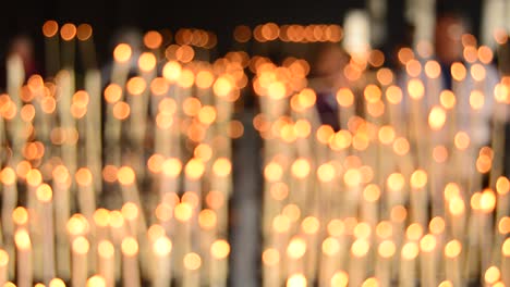 Candlestick-with-candles-defocused-or-blurred,-background