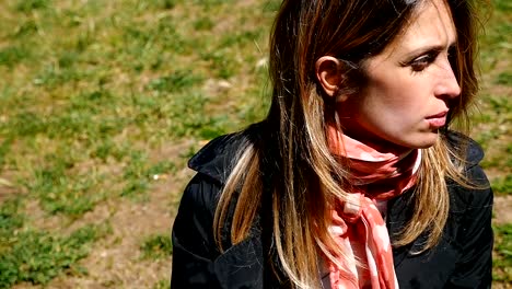 Close-up-portrait-of-pensive-e-depressed-woman-closing-her-eyes--outdoor