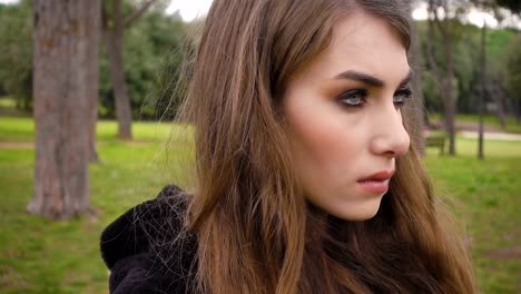 portrait-of-Beautiful-thoughtful-and-angry-woman-at-the-park