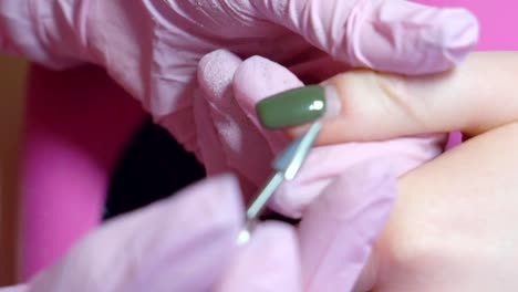 Slow-motion.-hardware-manicure.-removal-of-nail-polish-with-a-rotating-nail-file.-HD