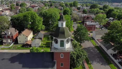 Slow-Reverse-Aerial-View-of-Small-Town's-Church-Steeple