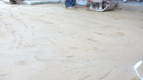 Worker-use-vibratory-plates-seals-the-base-sand