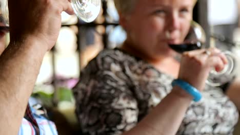 Couple-drinking-wine-in-street-cafe