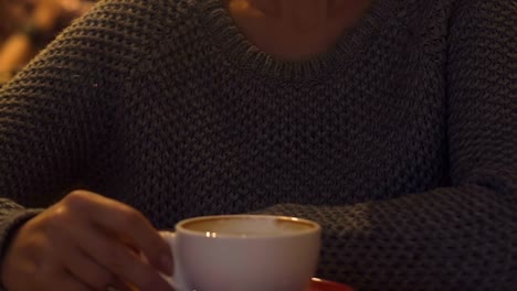 Unhappy-woman-sighing,-sitting-with-cup-of-coffee-in-restaurant,-loneliness