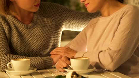 Women-chatting-over-cup-of-coffee,-supporting-in-difficulty,-female-friendship