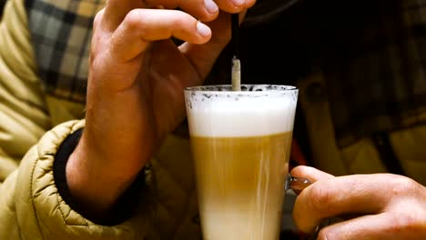 Coffee.-Men's-hands-take-a-cup-of-coffee