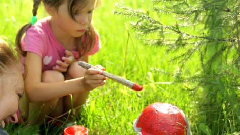 Kleines-Mädchen-Färbung-Gartendekoration