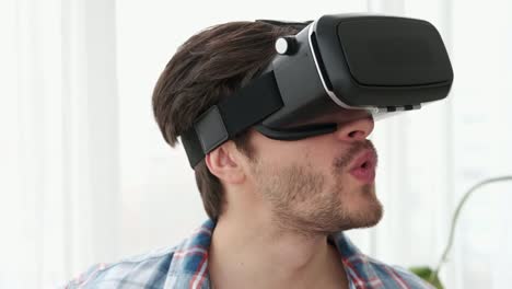 Man-enjoying-amazing-scene-in-virtual-reality-headset