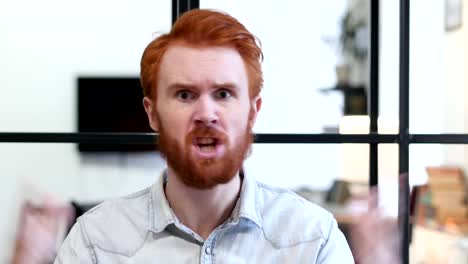 Portrait-of-Angry-Man-Yelling-toward-Camera