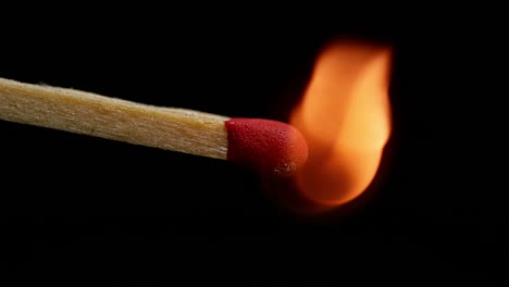 Igniting-Matches-against-Black-background,-Slow-motion-4K