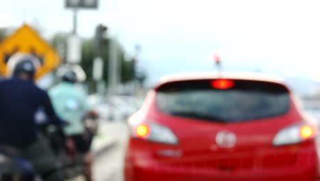 blur-front-view-scene-car-driving-traffic-jam-on-urban-road