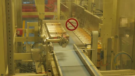 Folding-cardboard-boxes-on-a-conveyor-belt-in-a-rice-factory-–-4K