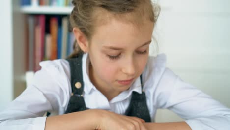 Cute-little-girl-is-reading-book.-Slow-motion.