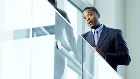 Multi-ethnic-male-female-business-team-shaking-hands