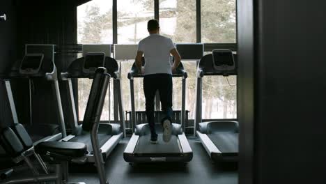 Man-Working-Out-in-Empty-Gym