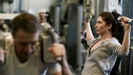 Man-and-Woman-Working-Out-in-Gym