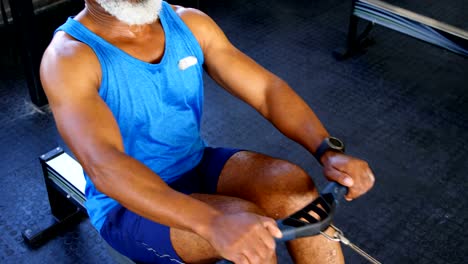 Senior-man-working-out-on-rowing-machine-4k