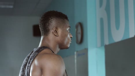 Man-walking-on-treadmill-and-drink-water