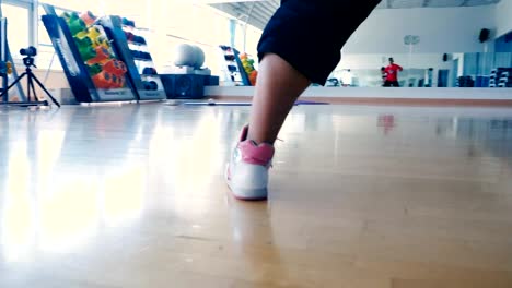 Close-up---the-man-in-sneakers-dancing-in-the-gym