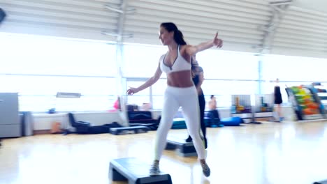 Beautiful-women-training-step-aerobics-in-the-gym