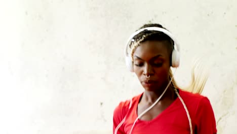 Fit-woman-exercising-with-headphones