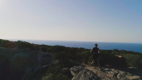 Running-man-arrives-on-top-of-a-cliff-on-an-island