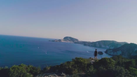 Running-man-arrives-on-top-of-a-cliff-on-an-island