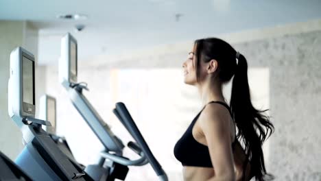 Cute-woman-exercising-in-the-gym