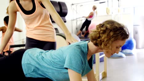 Beautiful-women-exercising-in-fitness-studio