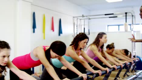 Beautiful-women-exercising-in-fitness-studio