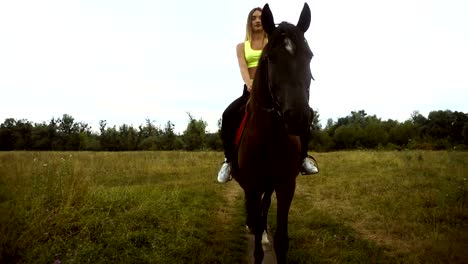 Lovely-slim-girl-rides-on-horseback