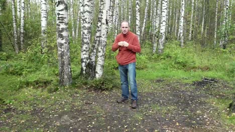 man-in-casual-clothes-does-fighting-martial-arts-on-a-forest-glade,slow-motion