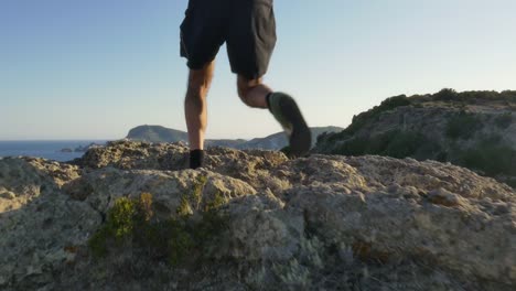 Running-man-arrives-on-top-of-a-cliff-on-an-island-in-front-of-the-ocean