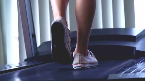 Young-Woman-Exercising-on-the-Treadmill-Machine