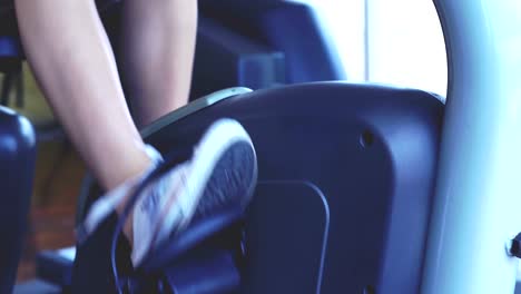 Young-Woman-Exercising-on-the-Cycling-Machine