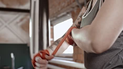 Female-Boxer-Wrapping-Hands-with-Bandage