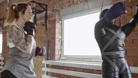 Female-Boxer-Striking-Punching-Bag