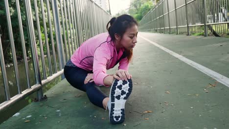 Fitness-sport-girl-fashion-sportswear-doing-yoga-fitness-exercise-in-street.-Fit-young-asian-woman-doing-training-workout-in-morning.-Young-happy-asian-woman-stretching-at-park-after-running-workout.