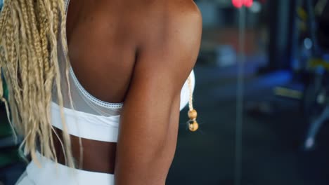 Woman-showing-biceps-after-exercise-with-dumbbell