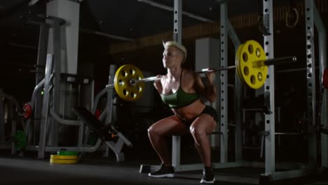Muscular-Woman-Doing-Weighted-Squats