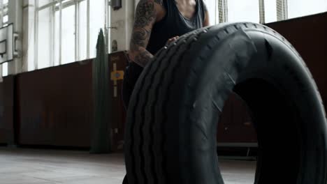 Determined-Woman-Flipping-Tire