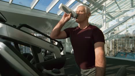 Grey-Haired-Man-Training-on-Treadmill