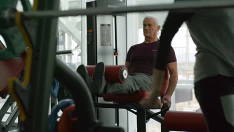 Grey-Haired-Man-Training-in-Gym