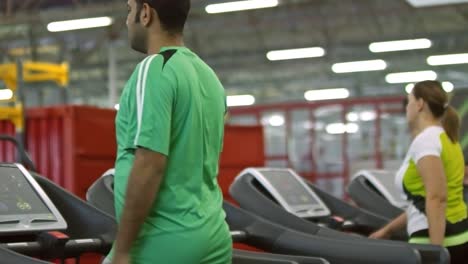 Man-Warming-Up-on-Treadmill-in-Gym