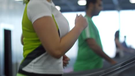 Woman-Running-on-Treadmill-in-Gym