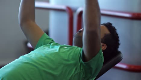 Man-Doing-Lying-Fly-Exercise-with-Dumbbells