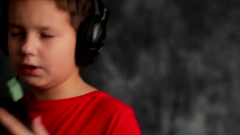 studio-portrait-of-a-young-teenager.-He-listens-to-music-in-the-headphones