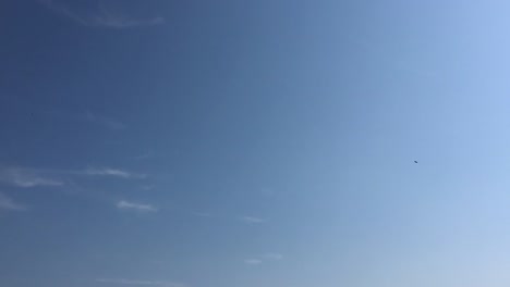 White-clouds-disappear-in-the-hot-sun-on-blue-sky.-Time-lapse-motion-clouds-blue-sky-background.-Blue-sky.-Clouds.-Blue-sky-with-white-clouds-and-sun.