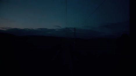 View-of-the-sky-from-the-rear-of-train-at-dawn