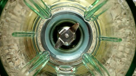 Falling-of-walnut-in-a-blender-bowl.-Slow-motion.	Top-view.